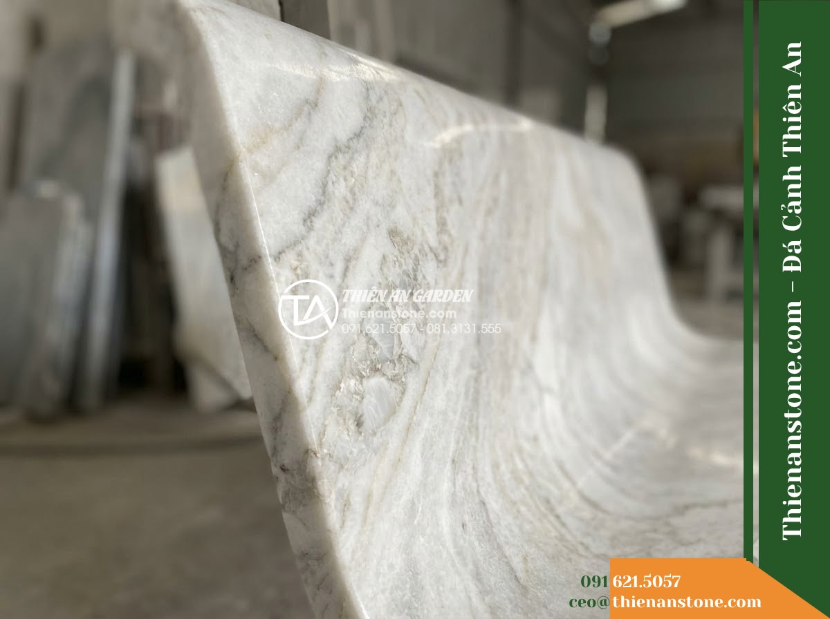 Ghế Đá Granito Quốc An – Kích thước 175 x 50 x 82 cm – Kiểu dáng tựa nan ngang dày, tay vịn liền. Chất liệu đá granito (đá mài) - Hình 4 Ghế Đá Granito Quốc An – Kích thước 175 x 50 x 82 cm – Kiểu dáng tựa nan ngang dày, tay vịn liền. Chất liệu đá granito (đá mài) - A granito polished stone stone bench integrated into a Vietnamese luxury resort