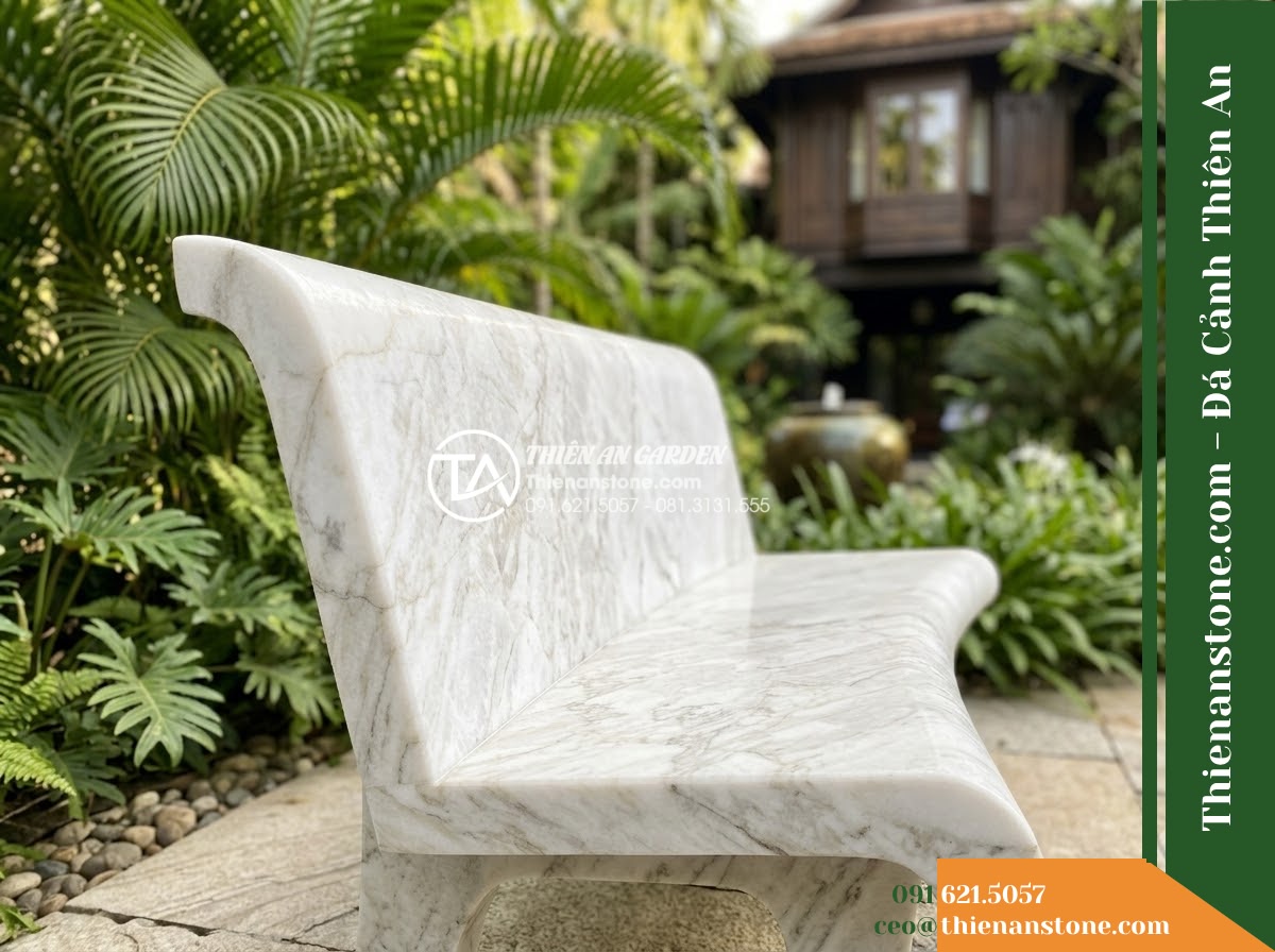 Ghế Đá Sân Trường Cánh Diều – Kích thước 150 x 48 x 78 cm – Kiểu dáng tựa nan thưa, đường nét mềm. Chất liệu đá hoa cương - Hình 4 Ghế Đá Sân Trường Cánh Diều – Kích thước 150 x 48 x 78 cm – Kiểu dáng tựa nan thưa, đường nét mềm. Chất liệu đá hoa cương - A granite stone bench integrated into a Vietnamese luxury resort landscape desig