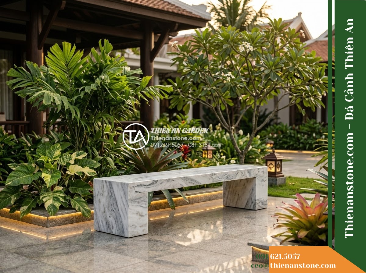 Ghế Đá Sân Trường Gieo Mầm – Kích thước 155 x 45 x 45 cm – Kiểu dáng băng dài không tựa, chân hộp. Chất liệu đá vân mây - Hình 4 Ghế Đá Sân Trường Gieo Mầm – Kích thước 155 x 45 x 45 cm – Kiểu dáng băng dài không tựa, chân hộp. Chất liệu đá vân mây - A cloud marble stone bench integrated into a Vietnamese luxury resort landscape