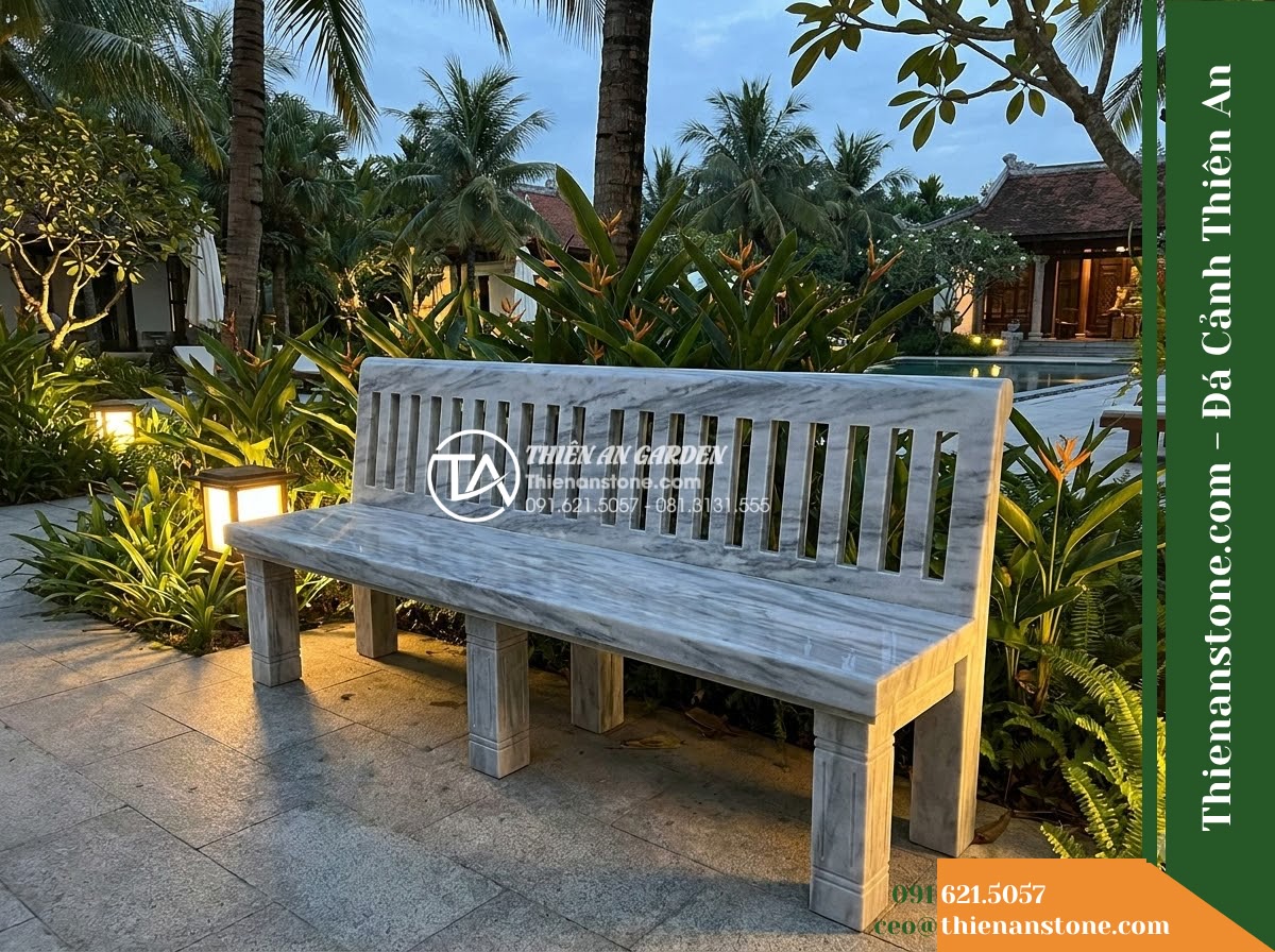 Ghế Đá Sân Trường Thành Công – Kích thước 180 x 50 x 84 cm – Kiểu dáng tựa cao nan dọc, chân trụ vuông. Chất liệu đá vân mây - Hình 4 Ghế Đá Sân Trường Thành Công – Kích thước 180 x 50 x 84 cm – Kiểu dáng tựa cao nan dọc, chân trụ vuông. Chất liệu đá vân mây - A cloud marble stone bench integrated into a Vietnamese luxury resort landscape