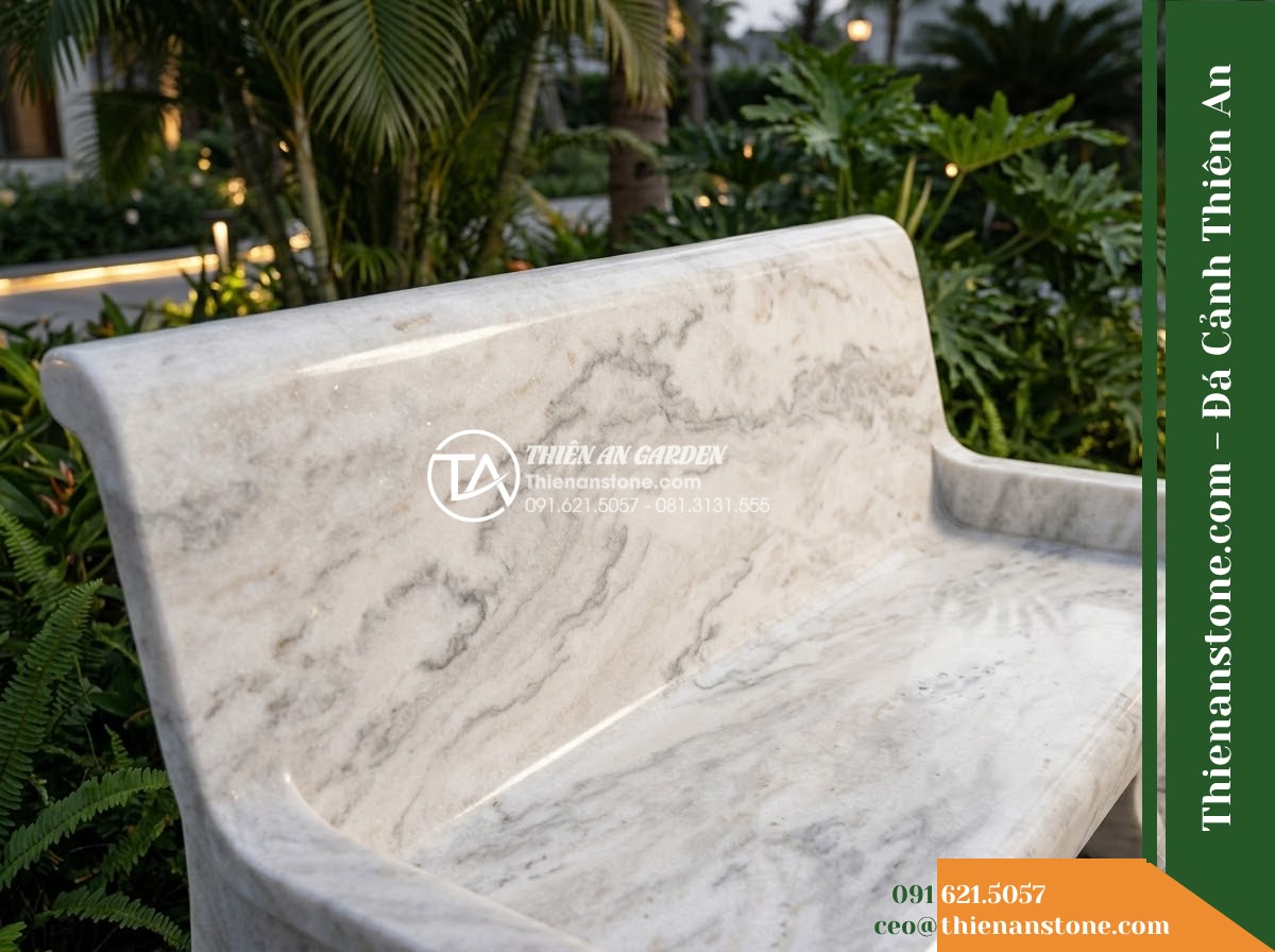Ghế Đá Sân Trường Thành Nhân – Kích thước 185 x 50 x 80 cm – Kiểu dáng tựa liền rộng, tay vịn thấp. Chất liệu đá vân mây - Hình 4 Ghế Đá Sân Trường Thành Nhân – Kích thước 185 x 50 x 80 cm – Kiểu dáng tựa liền rộng, tay vịn thấp. Chất liệu đá vân mây - A cloud marble stone bench integrated into a Vietnamese luxury resort landscape
