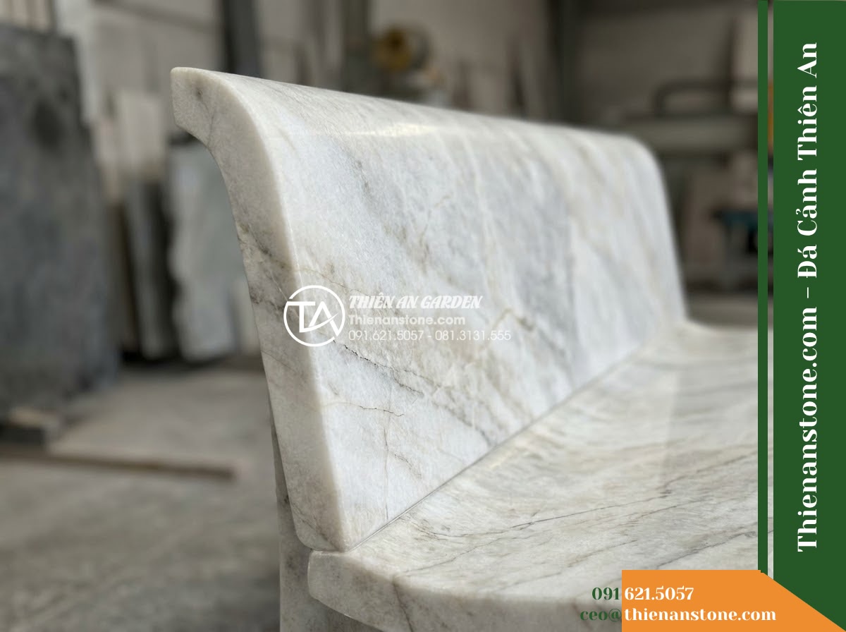 Ghế Đá Sân Trường Tuổi Thơ – Kích thước 145 x 44 x 45 cm – Kiểu dáng băng thấp, hai đầu bo tròn. Chất liệu đá Xanh rêu - Hình 2 Ghế Đá Sân Trường Tuổi Thơ – Kích thước 145 x 44 x 45 cm – Kiểu dáng băng thấp, hai đầu bo tròn. Chất liệu đá Xanh rêu - Aerial view of a green moss stone stone bench positioned beside a koi pond in a