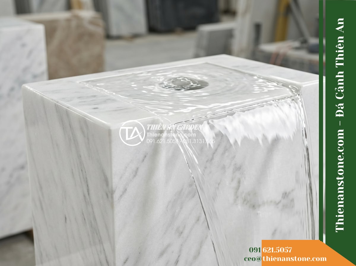 Trụ Phun Chữ Nhật Phẳng Mặt, 40x25cm Cao 1m - Hình 7 Trụ Phun Chữ Nhật Phẳng Mặt, 40x25cm Cao 1m - Detailed close-up showing water brimming gently from the center aperture of the