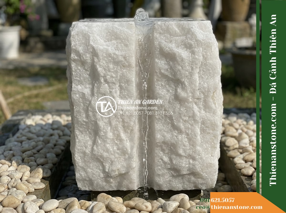 Trụ Phun Khối Thô Bổ Đôi Rãnh Nước, D45cm Cao 1m - Hình 8 Trụ Phun Khối Thô Bổ Đôi Rãnh Nước, D45cm Cao 1m - A side profile view illustrating the relationship between the chiseled stone fou