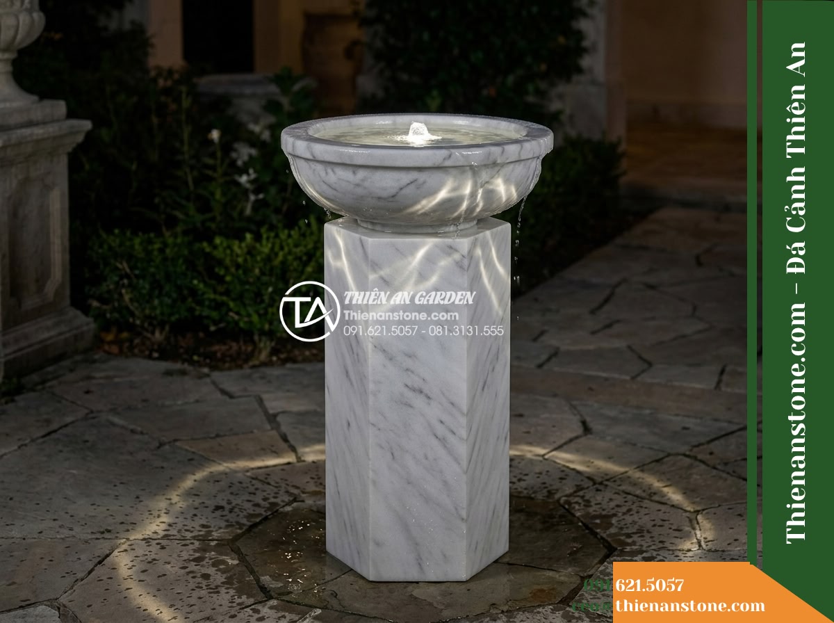 Trụ Phun Lục Giác Đỉnh Bát Phun, D40cm Cao 1m - Hình 14 Trụ Phun Lục Giác Đỉnh Bát Phun, D40cm Cao 1m - Night scene of the courtyard featuring the hexagonal stone fountain, illuminated