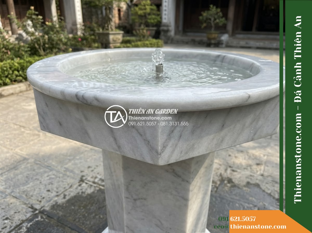 Trụ Phun Lục Giác Đỉnh Bát Phun, D40cm Cao 1m - Hình 2 Trụ Phun Lục Giác Đỉnh Bát Phun, D40cm Cao 1m - A low diagonal medium shot emphasizing the precise transition from the circular