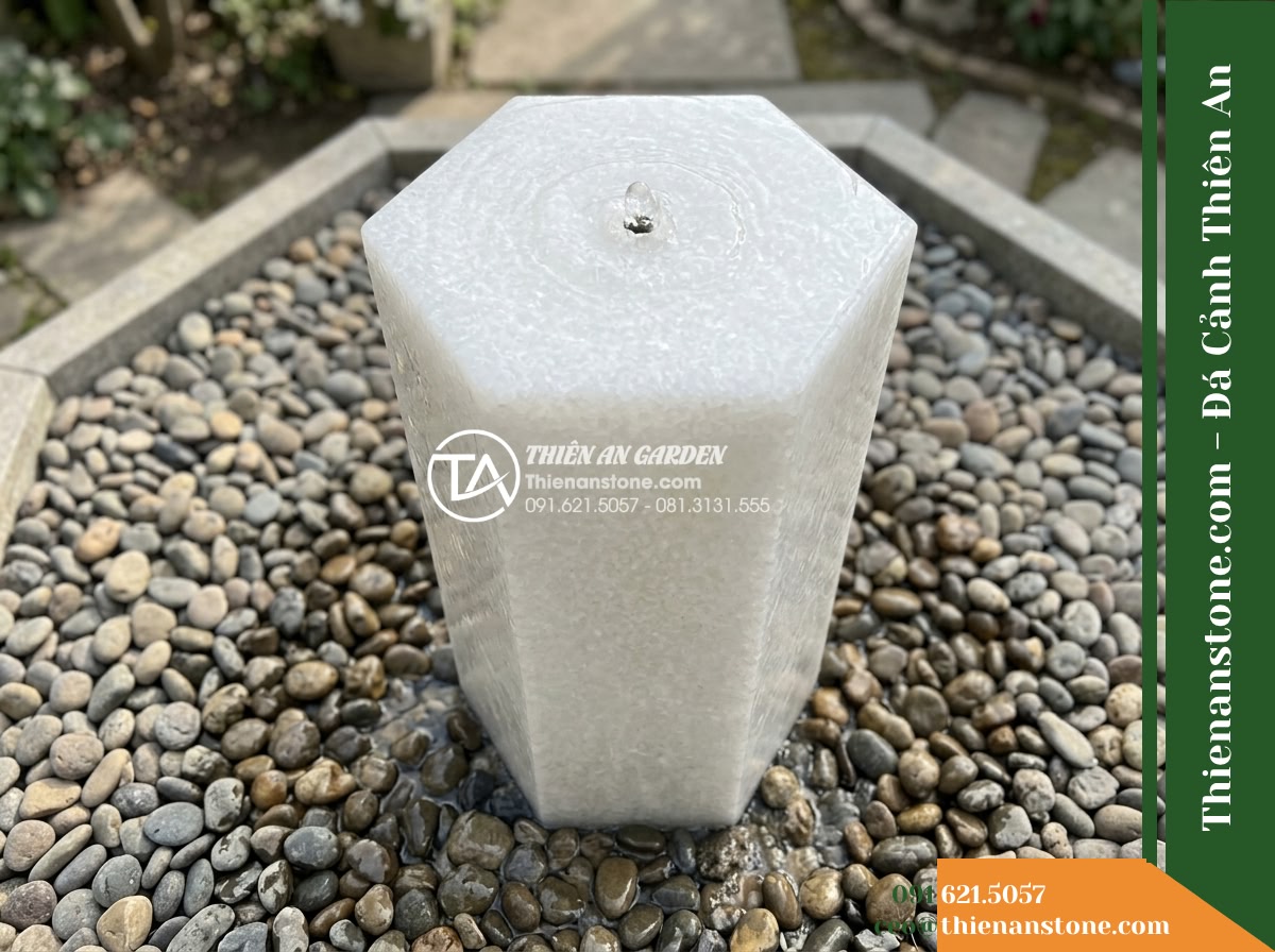 Trụ Phun Lục Giác Mài Bóng Nhẹ, D35cm Cao 80cm - Hình 6 Trụ Phun Lục Giác Mài Bóng Nhẹ, D35cm Cao 80cm - High-angle view overlooking the hexagonal fountain footprint, showcasing the sur