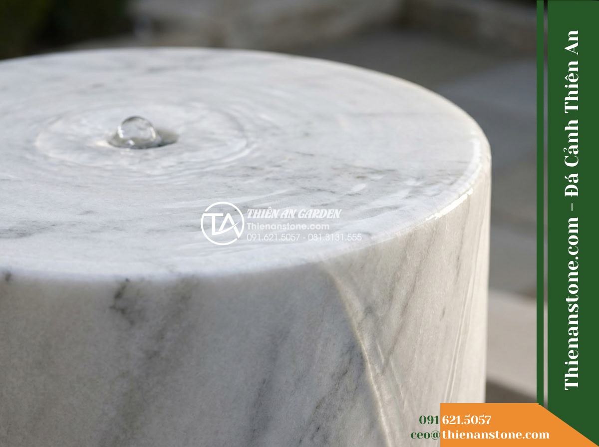 Trụ Phun Tròn Lỗ Xuyên Tâm, Mài Nhẵn D30cm Cao 80cm - Hình 7 Trụ Phun Tròn Lỗ Xuyên Tâm, Mài Nhẵn D30cm Cao 80cm - Simulated detailed view of water welling up gently from the concealed central co