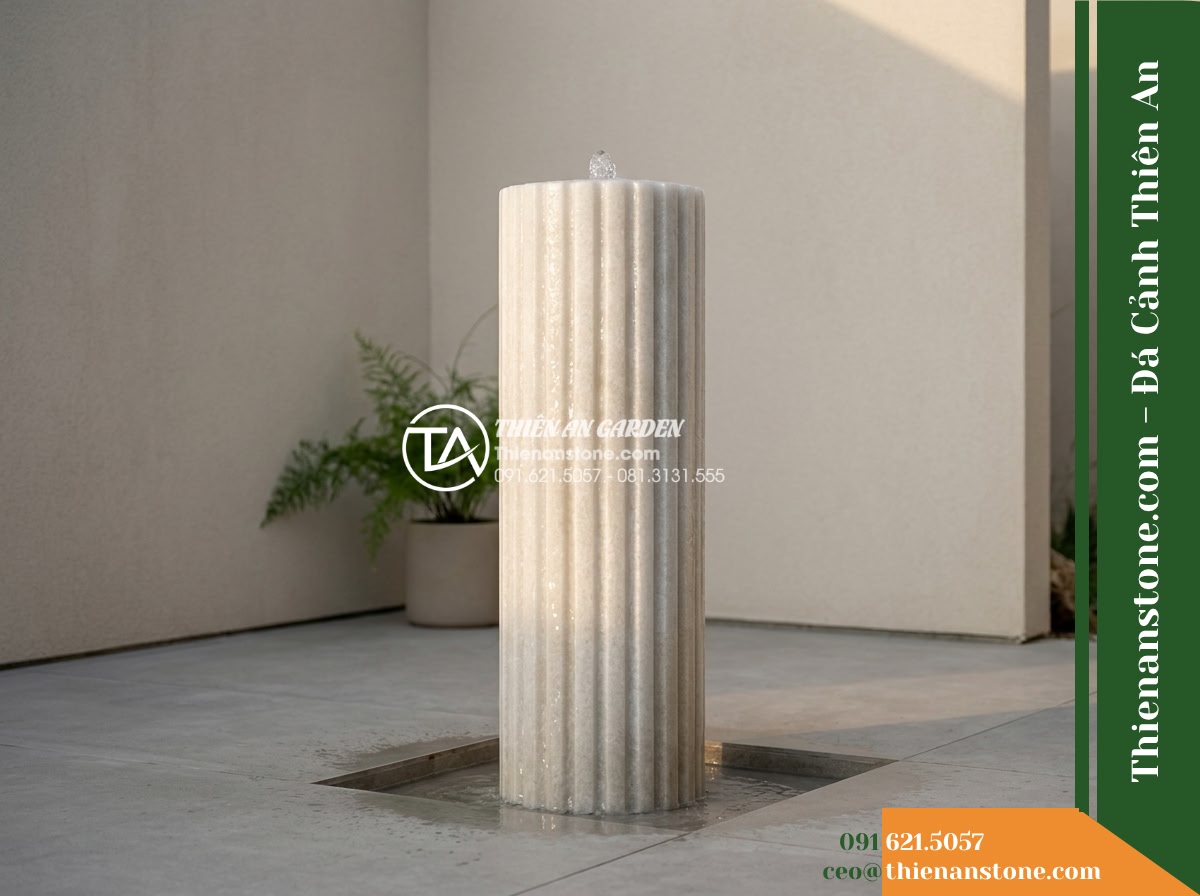 Trụ Phun Tròn Xẻ Rãnh Dọc Thân, Mài Mịn D35cm Cao 1m - Hình 19 Trụ Phun Tròn Xẻ Rãnh Dọc Thân, Mài Mịn D35cm Cao 1m - Atmospheric architectural photograph of the completed fluted stone water column